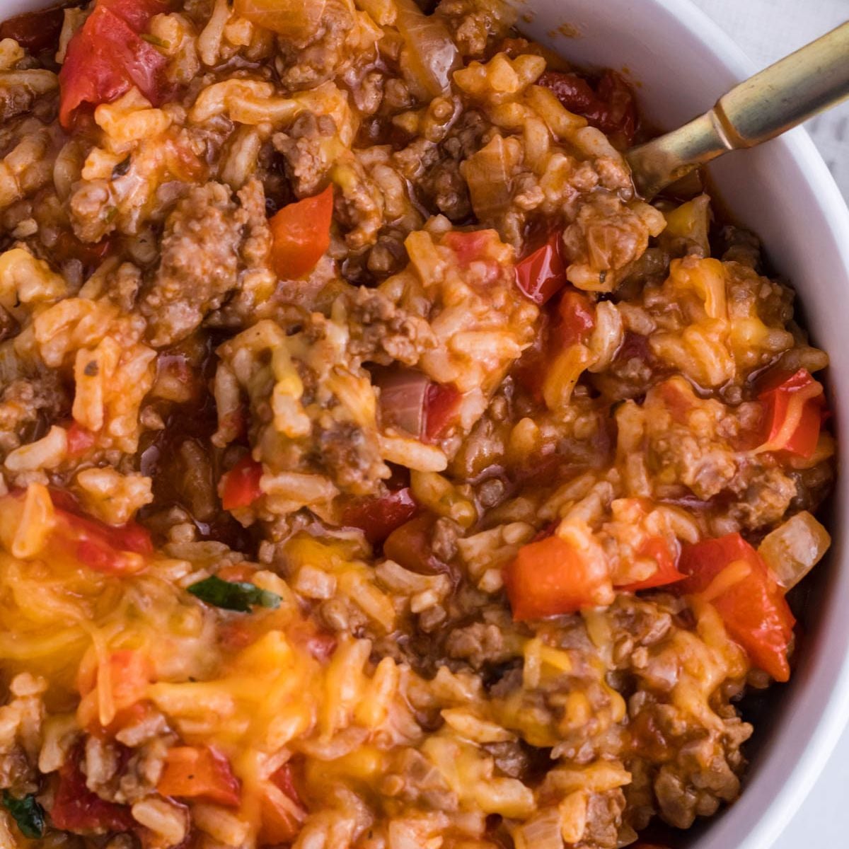Stuffed Pepper Casserole in a bowl with fork on the side