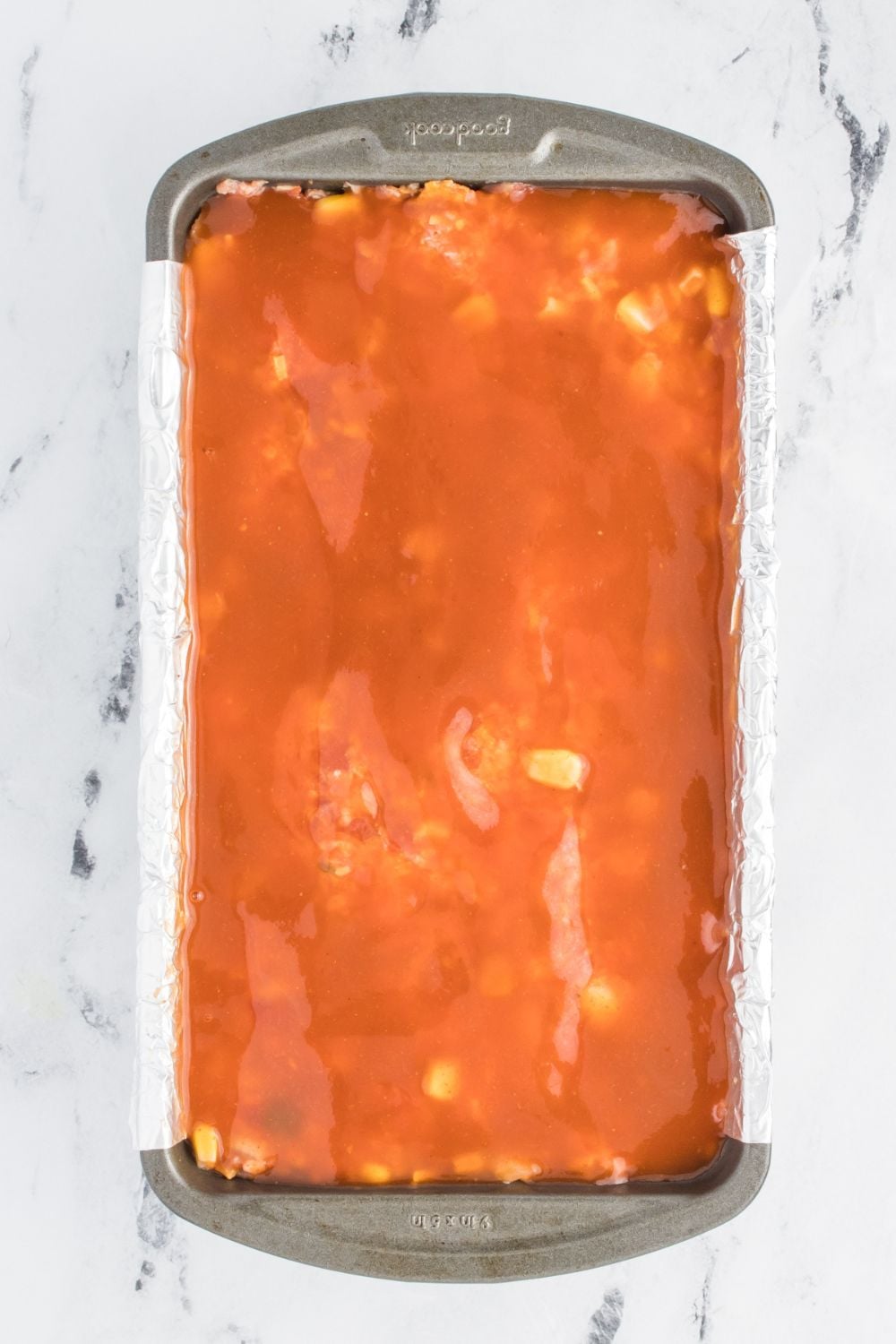 enchilada sauce poured over meatloaf