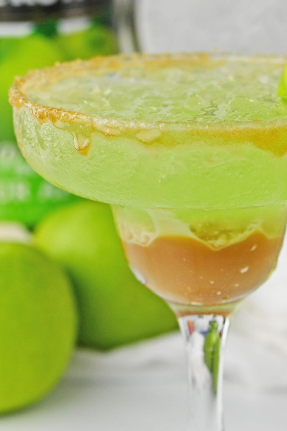 close up view of caramel apple cocktail in glass