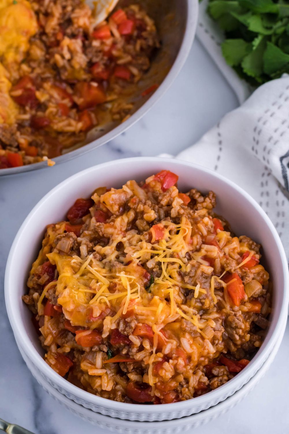 rice casserole in pan and bowl on table