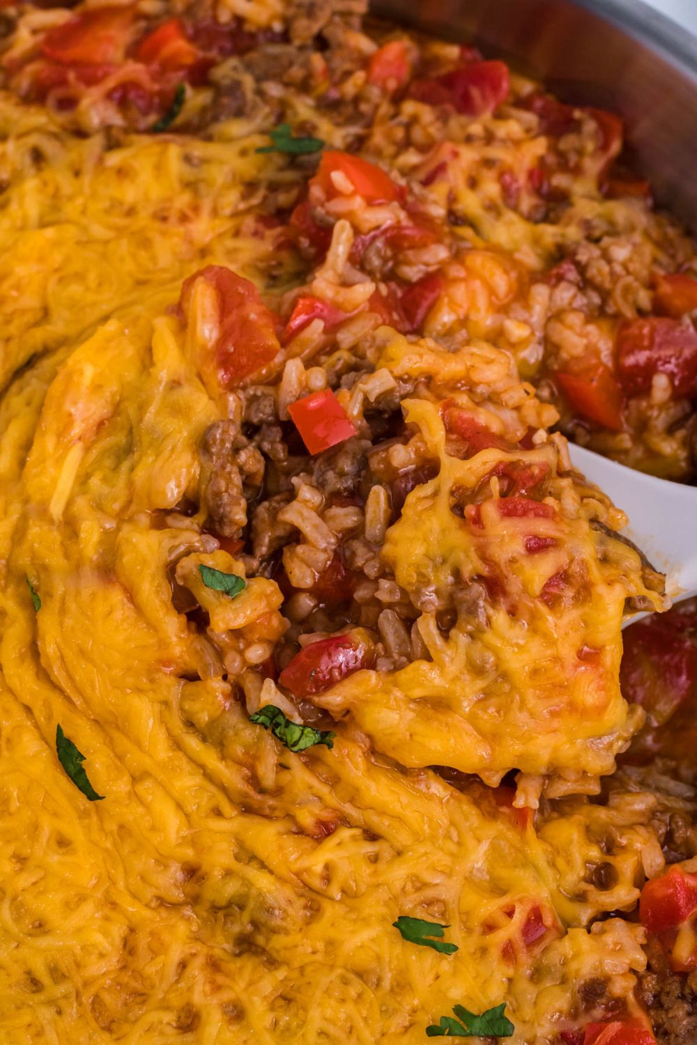 Stuffed Pepper Casserole in pan with a spoon scooping some up