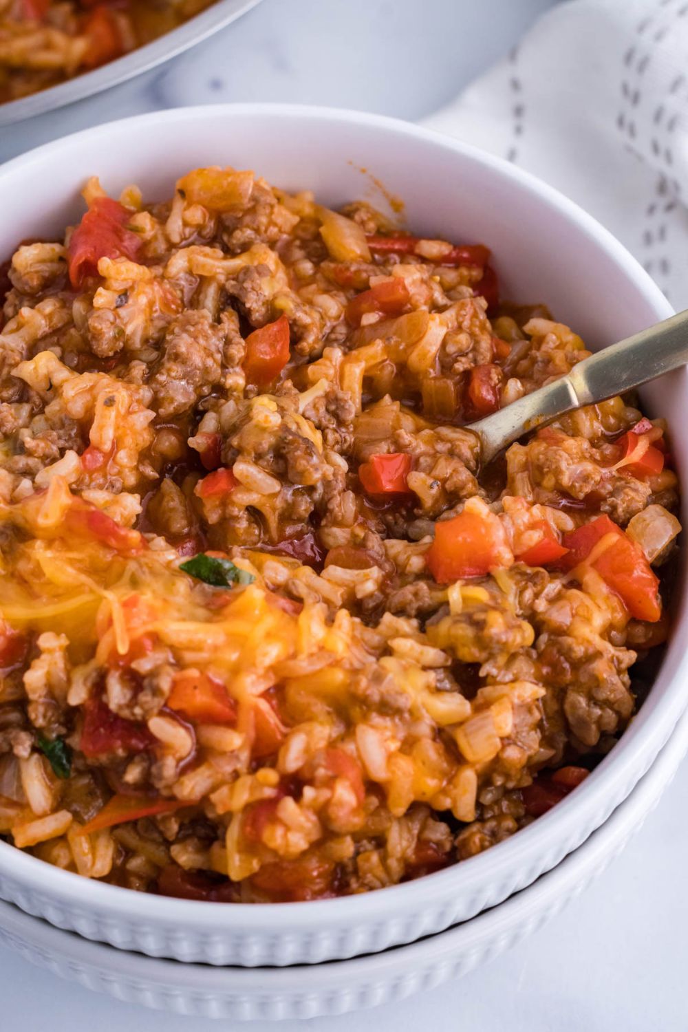 bowl with a spoon in it with pepper casserole
