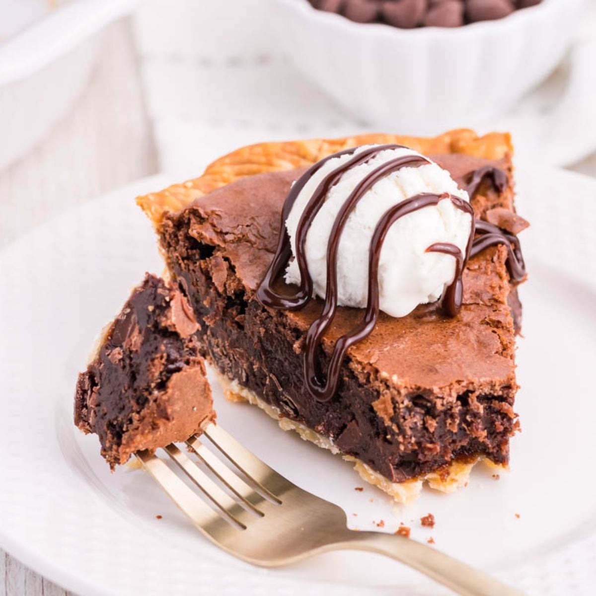 Brownie Pie on plate with a fork with bite on side