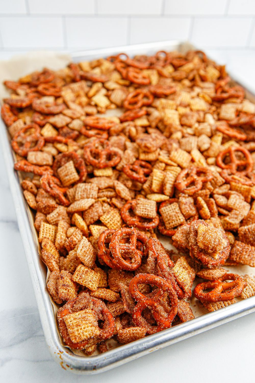 Churro Chex Mix in a cookie sheet on table