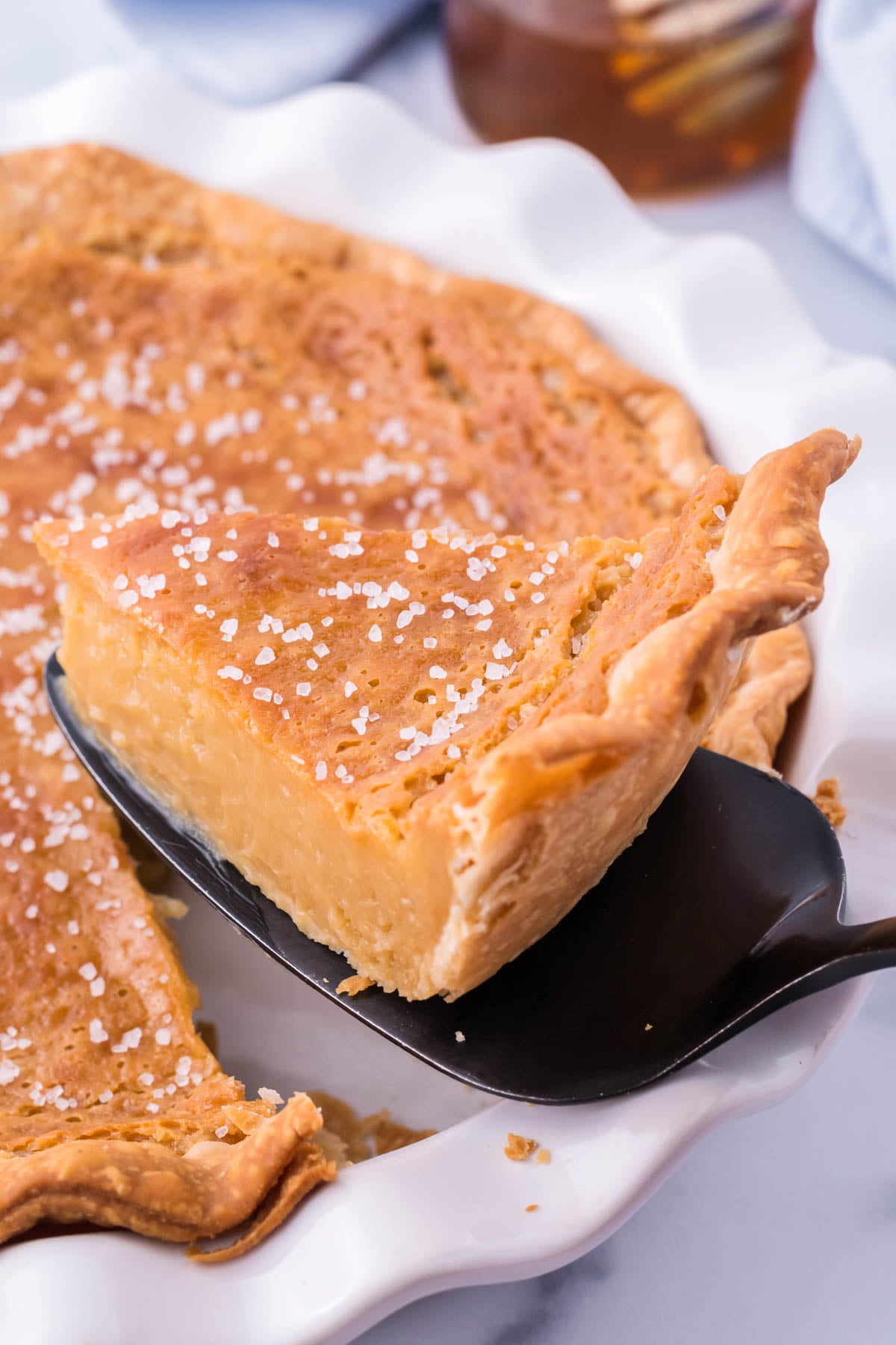 Honey Pie being lifted out of a white pie dish