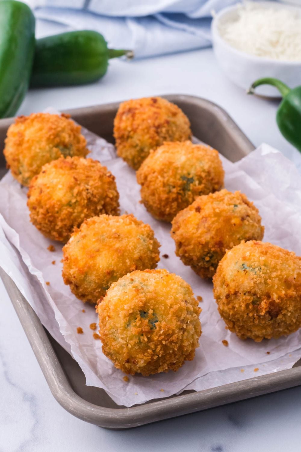 Jalapeno Popper Bites on a baking tray on table