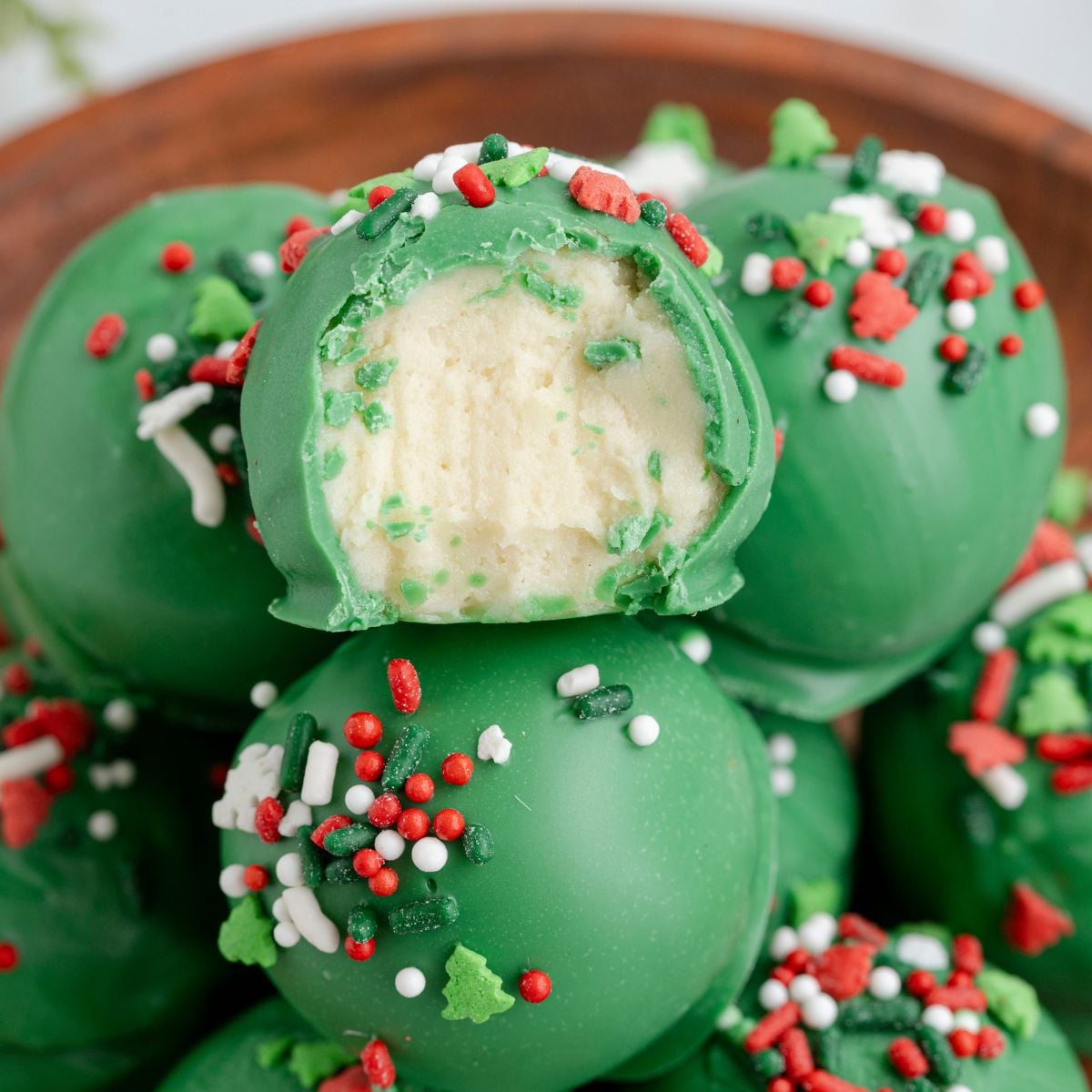 Lofthouse Christmas Truffles in a bowl with one has a bite taken out of it