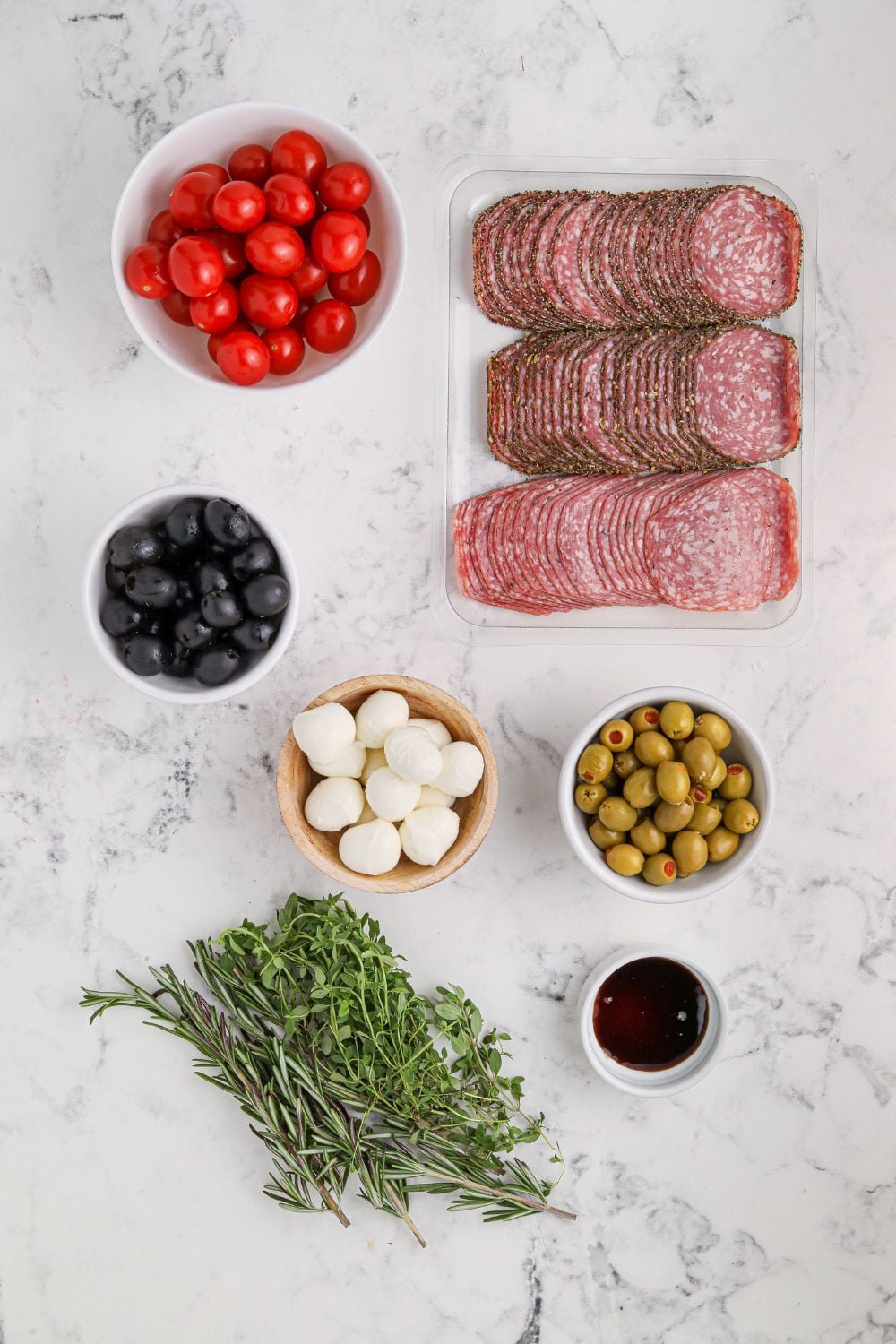 ingredients for antipasto on marble table