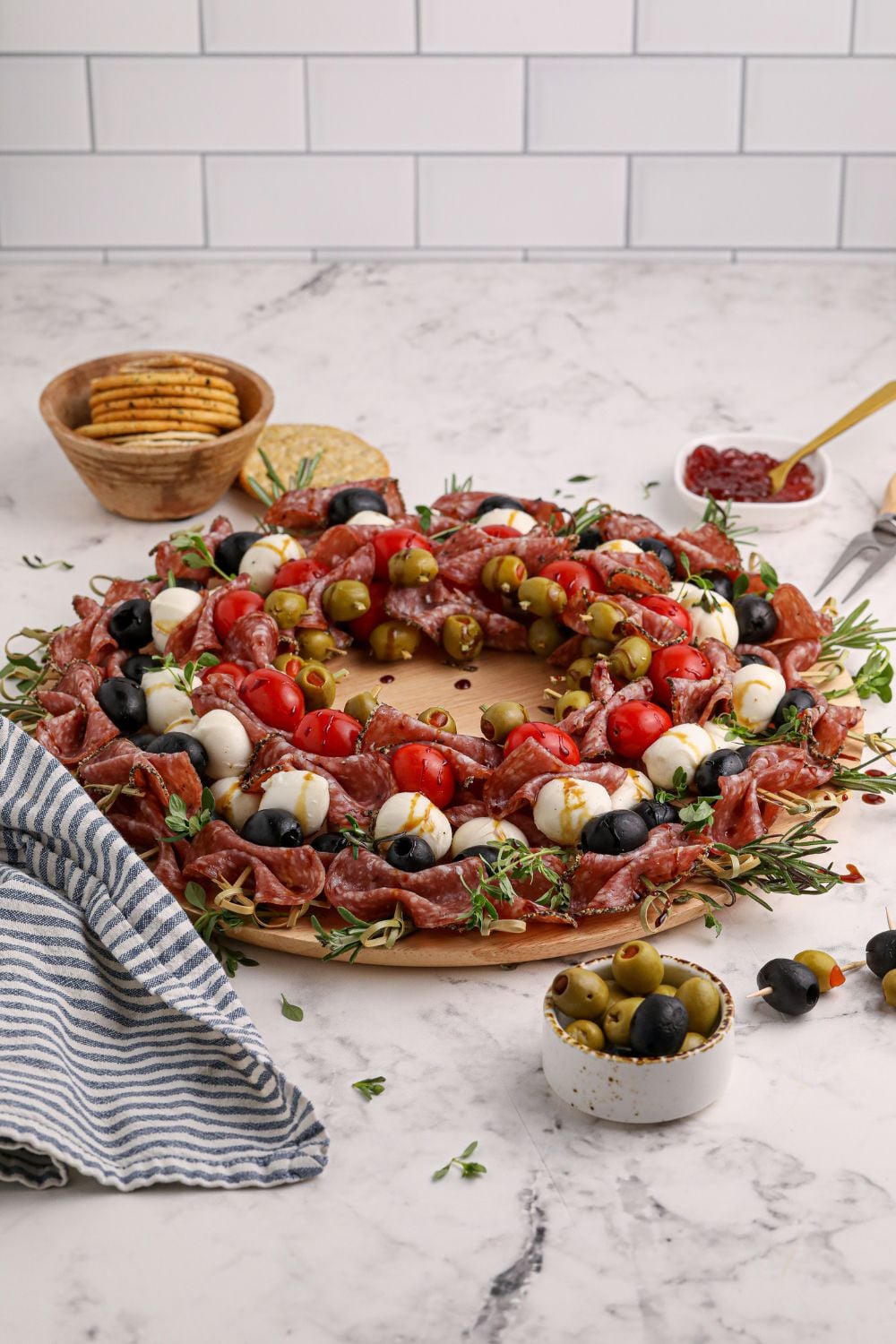 antipasto bites on table with items around it 