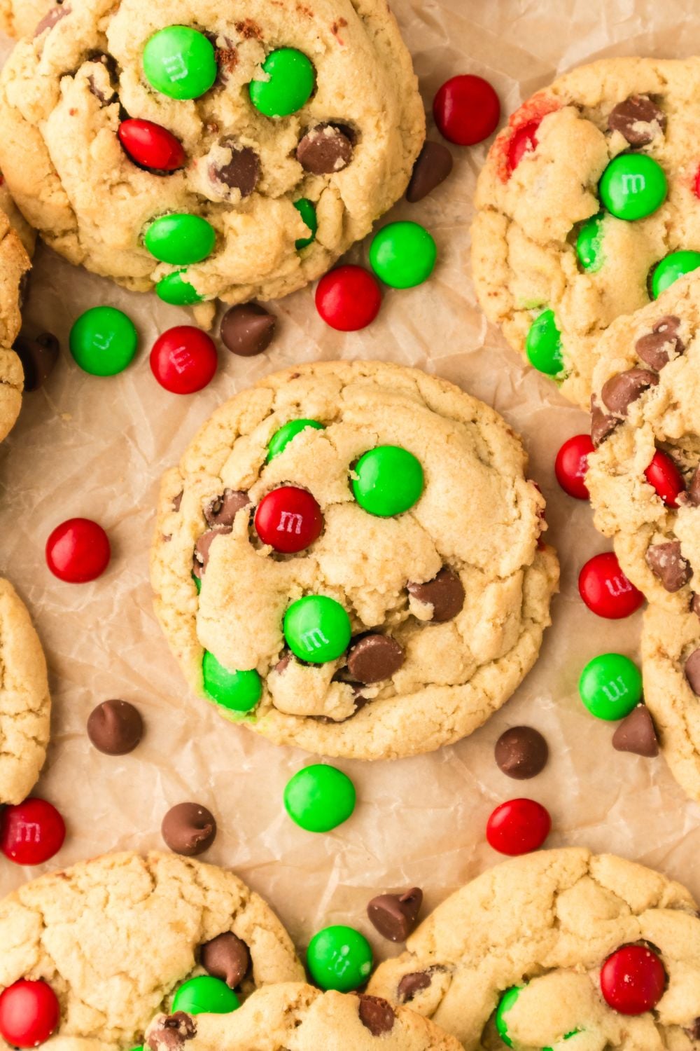 cookies on table with parchment paper under it and candies around it