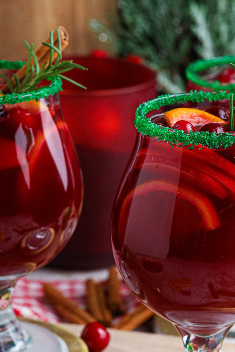 red wine with fruit in glasses on table