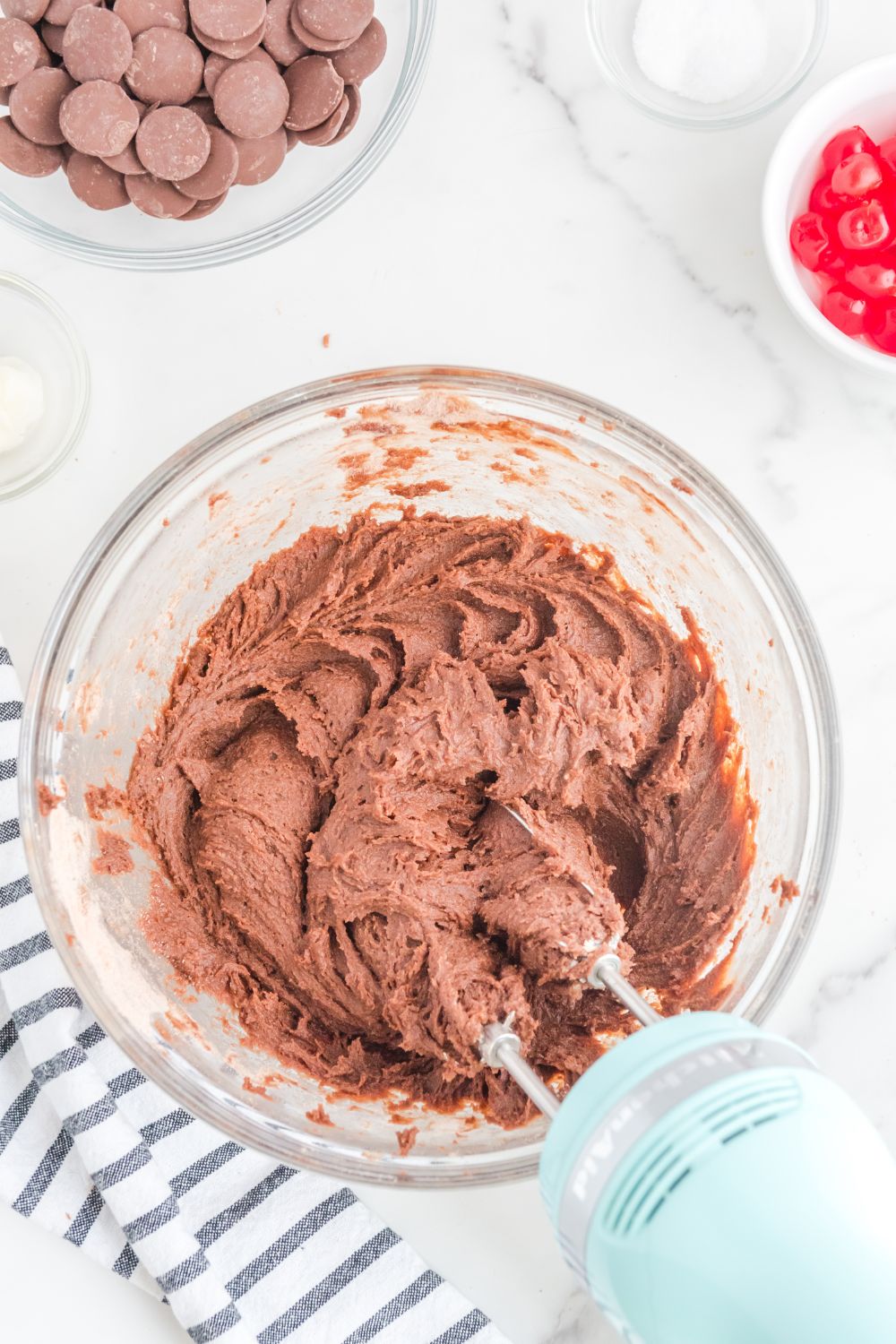 brownie batter in a bowl with mixer in bowl 