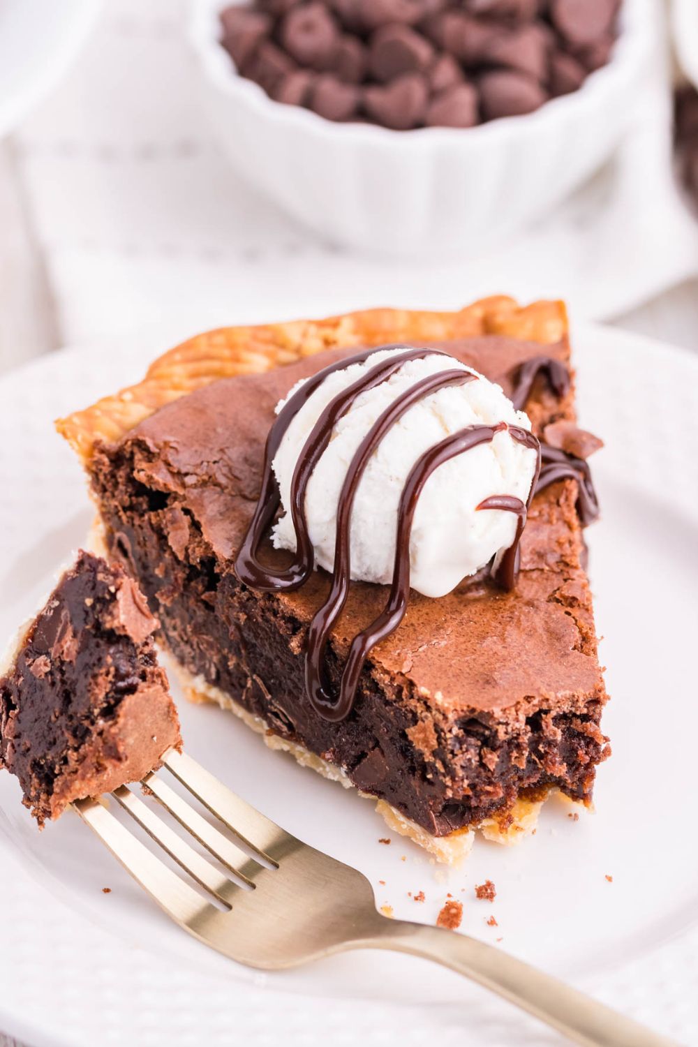 brownie fudge pie on plate with a bite on fork