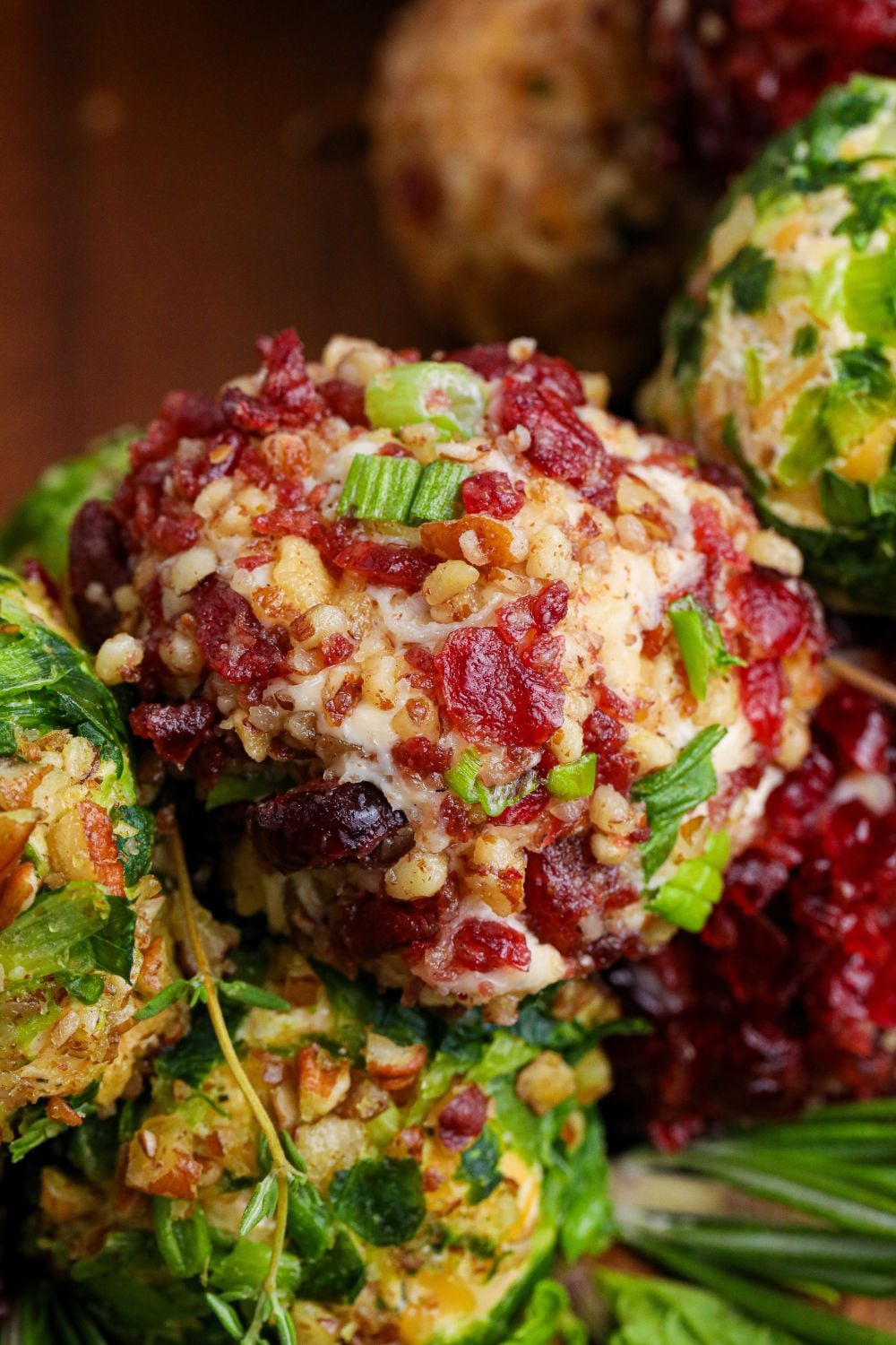 close up of cheese balls stacked on wooden table
