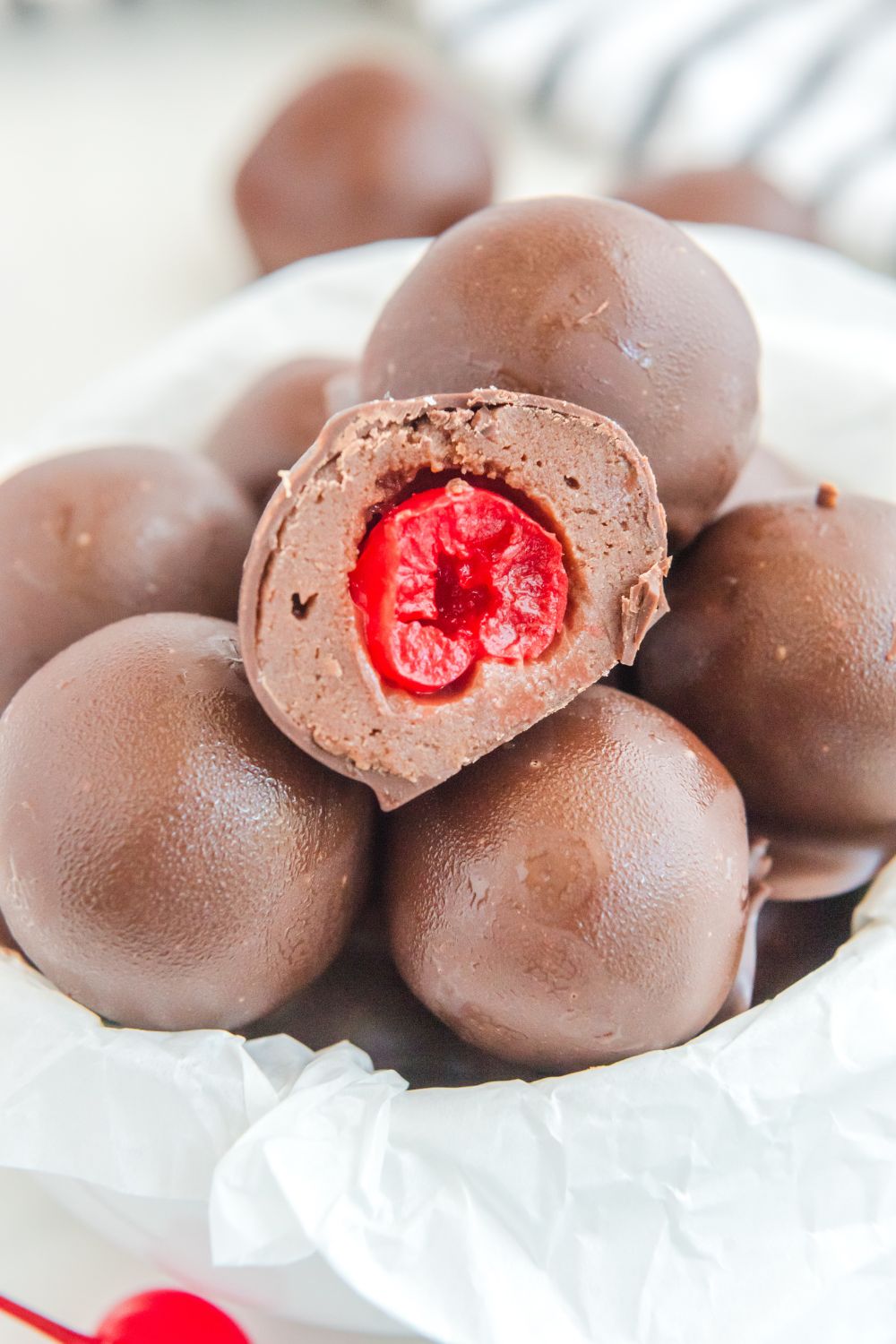 Cherry Brownie Bomb cut in half to showcase the cherry 