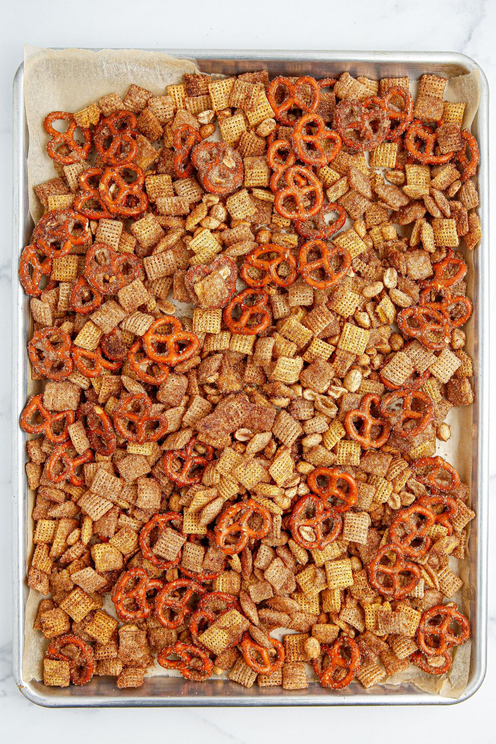 chex mix on a cookie sheet