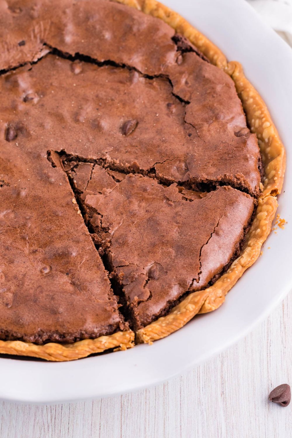 chocolate brownie pie with a slice cut into it