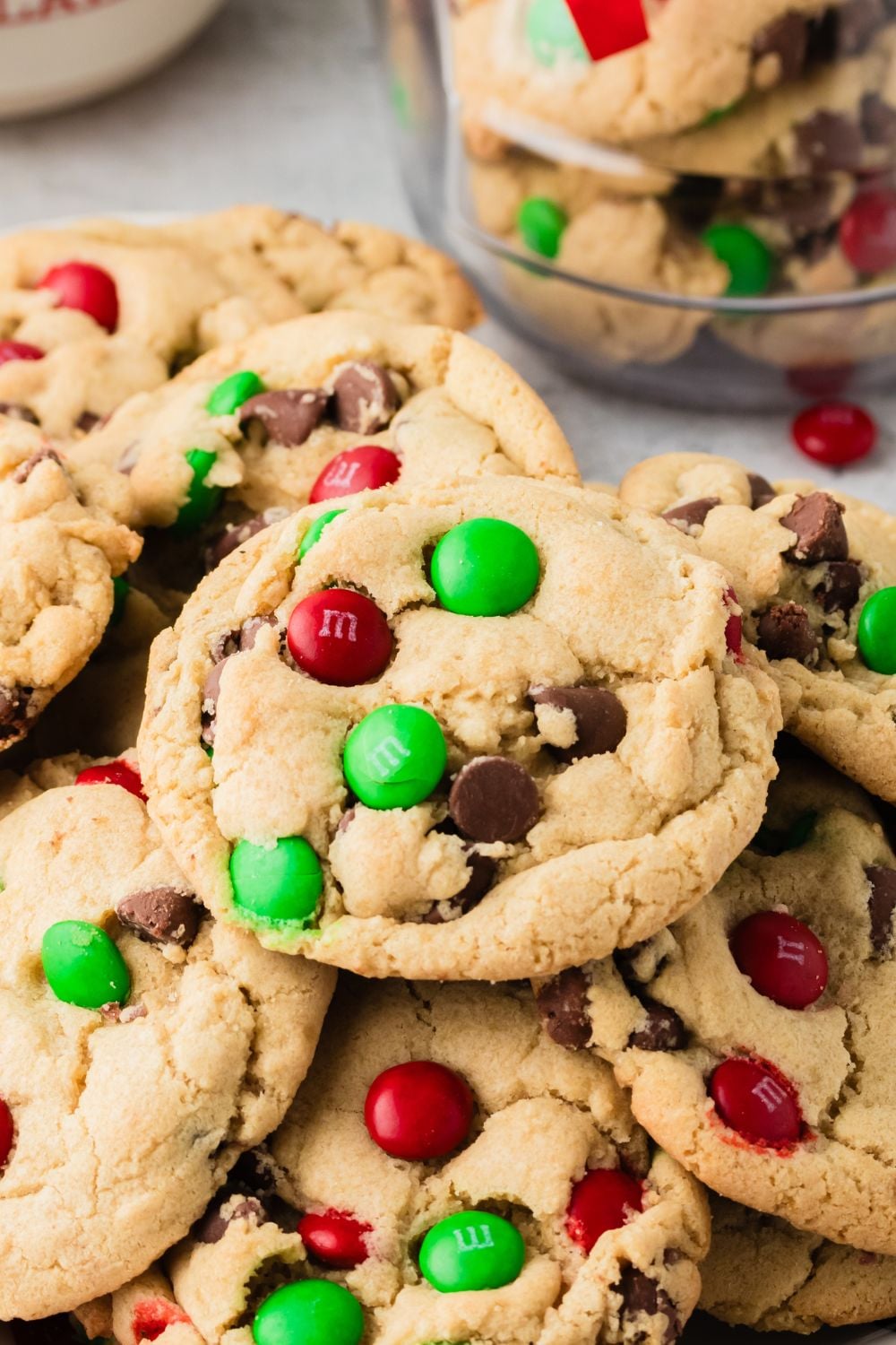 Christmas M&M Cookies stacked on table