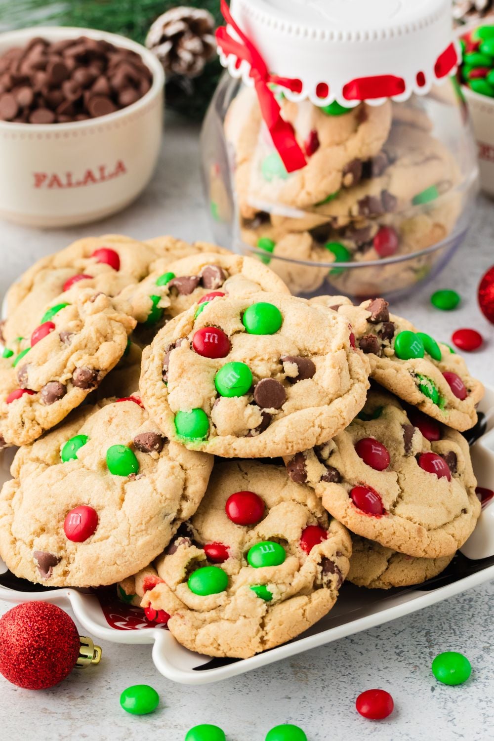 M&M Cookies on table with jar of cookies behind it