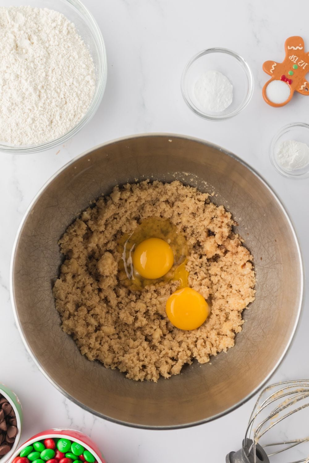eggs in cookie mix in a stand mixer bowl