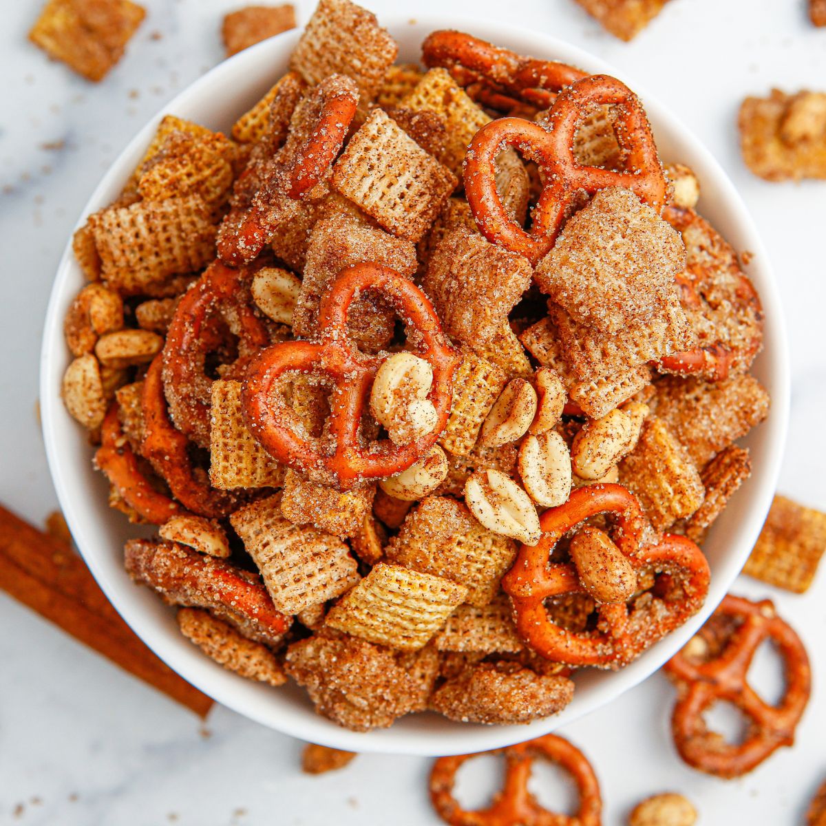 Churro Chex Mix in a bowl on marble counter