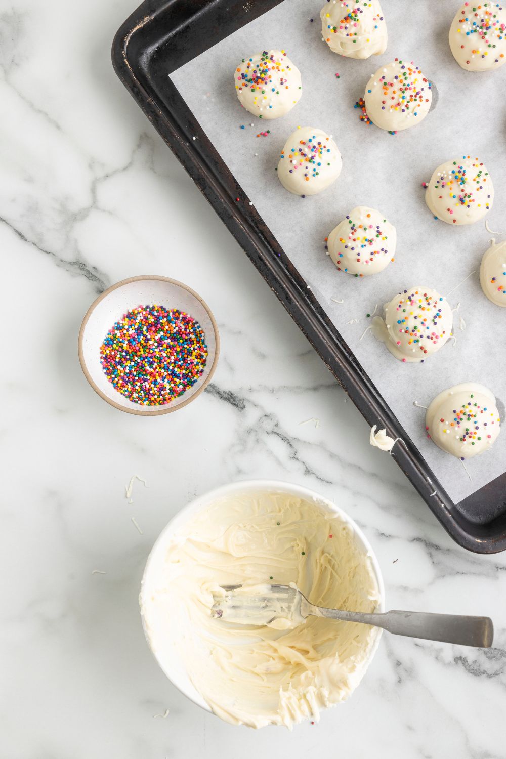 white chocolate truffles on a baking tray 