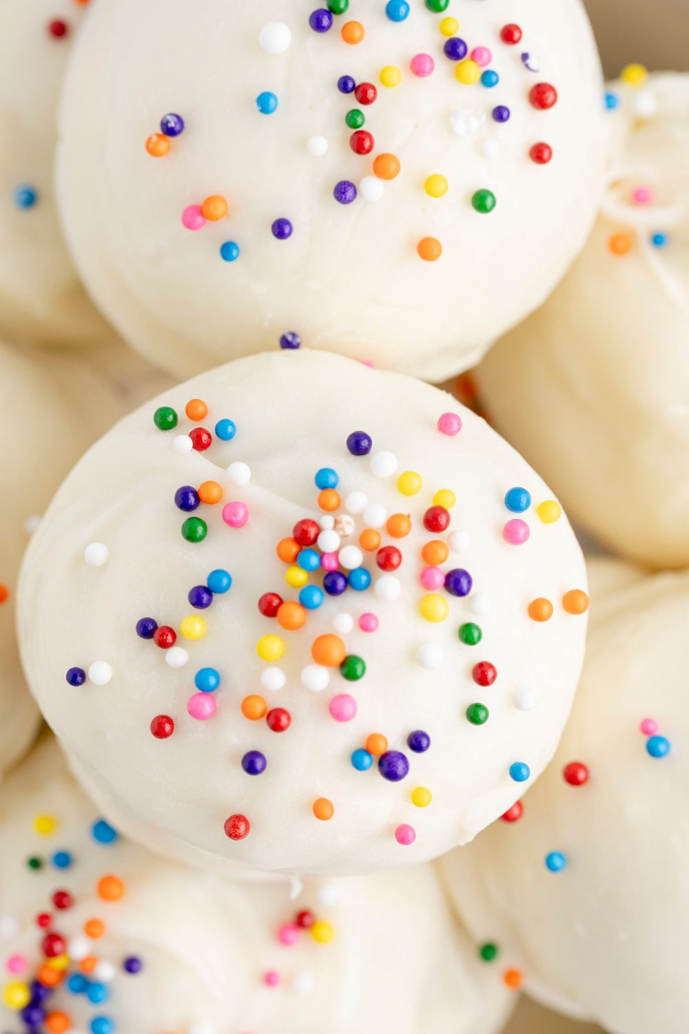 close up truffles in a bowl with sprinkles 
