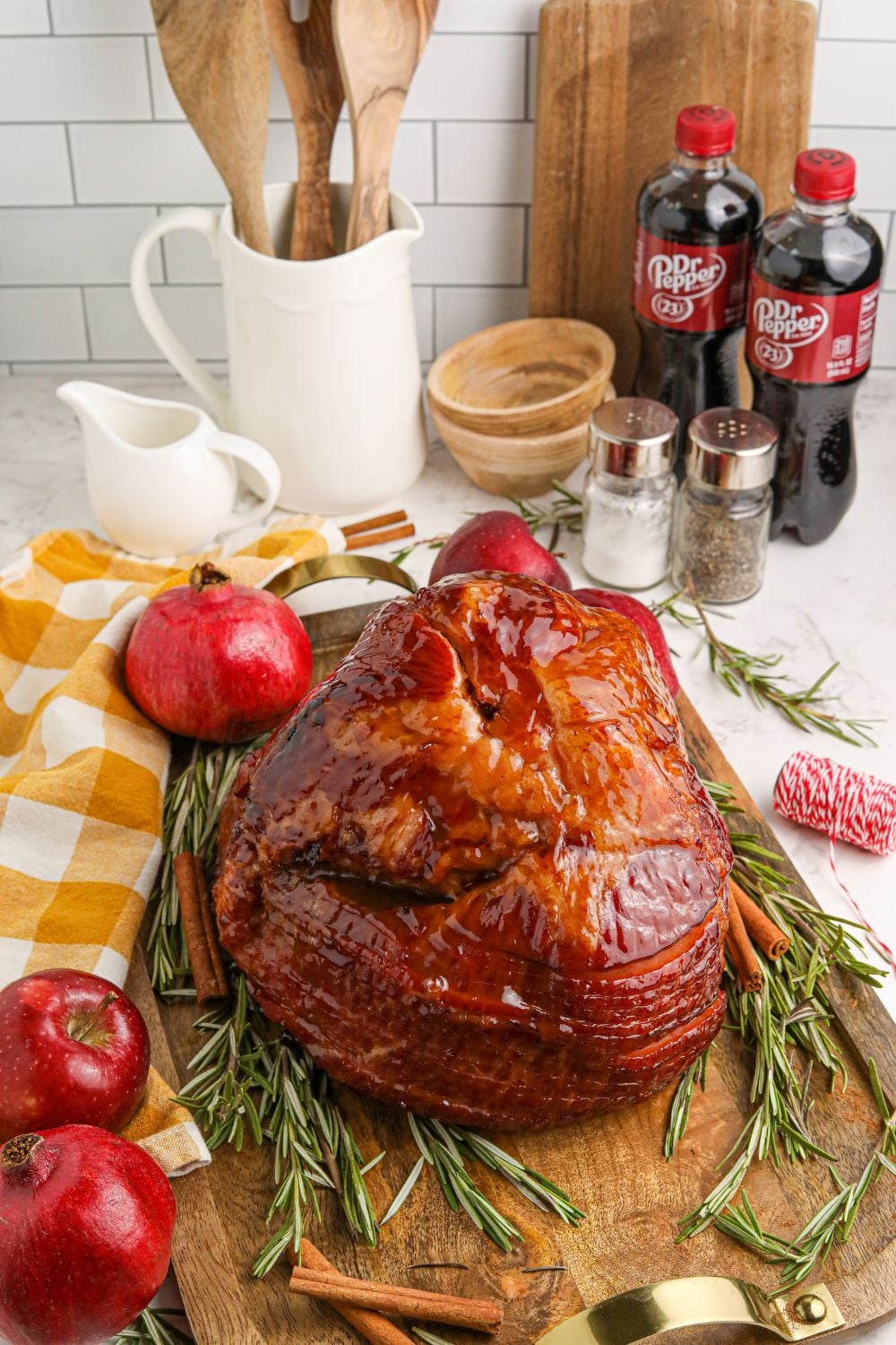 holiday ham on table with items all around it