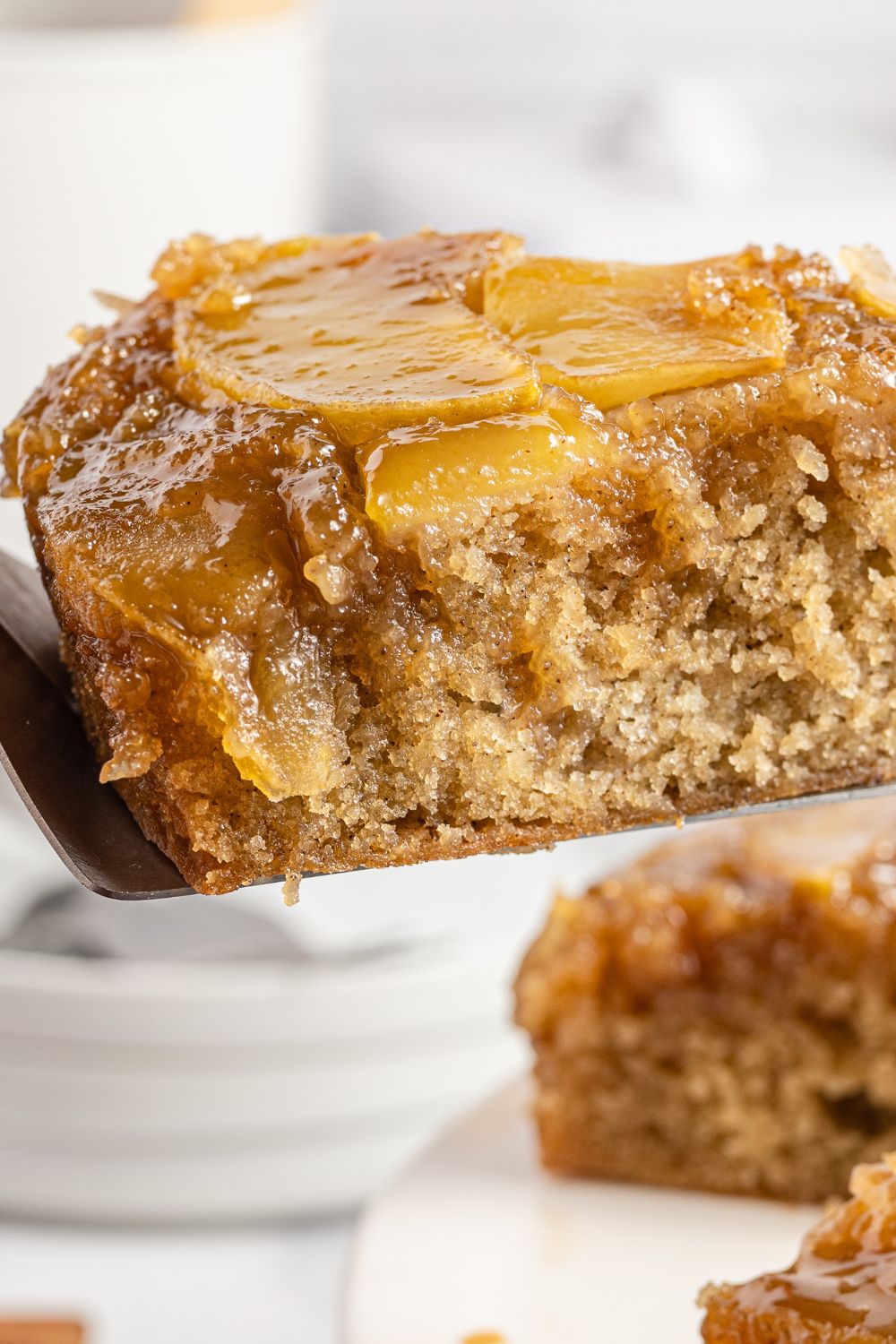 slice of cake on spatula above the baking pan