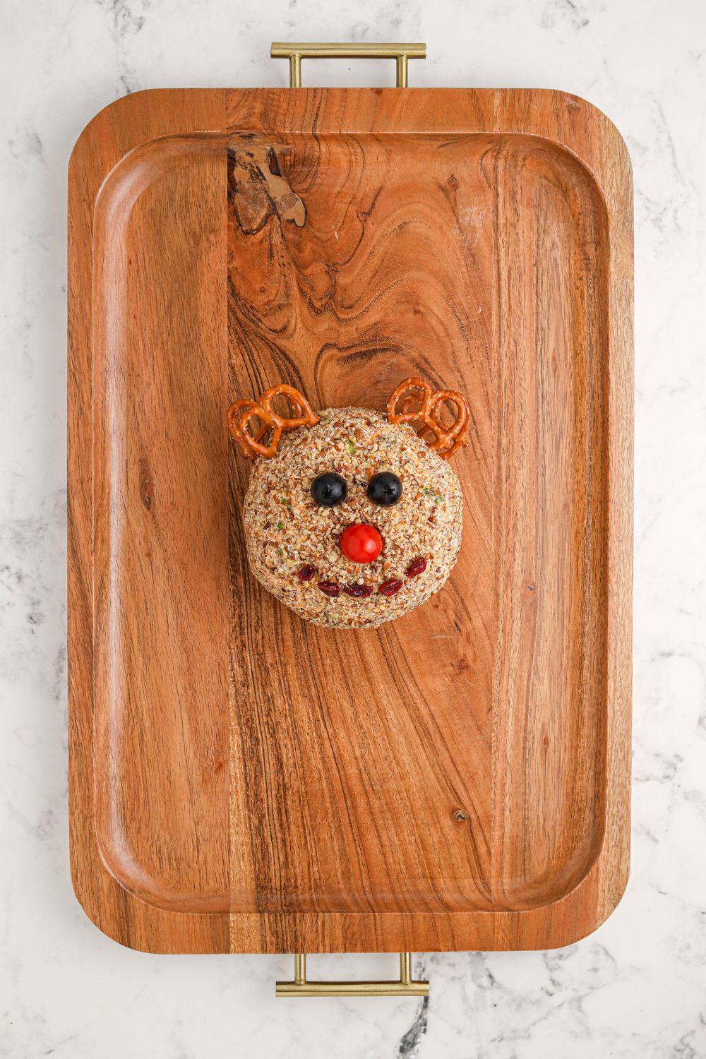 rudolph cheeseball on wooden tray