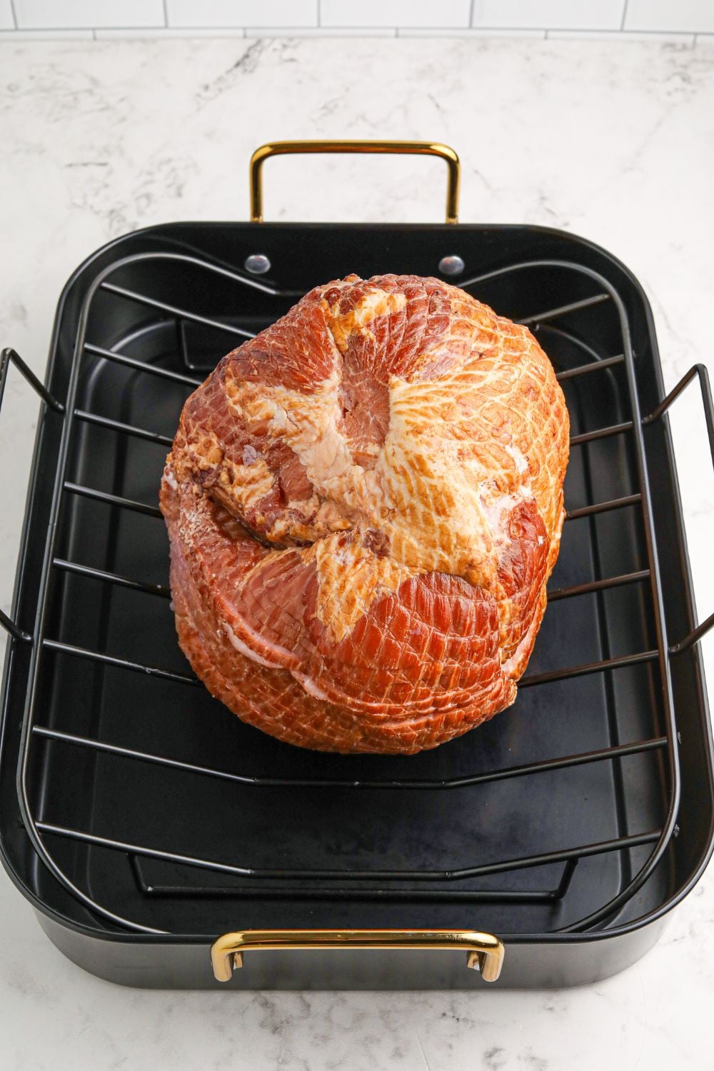 spiral ham sitting on roasting pan