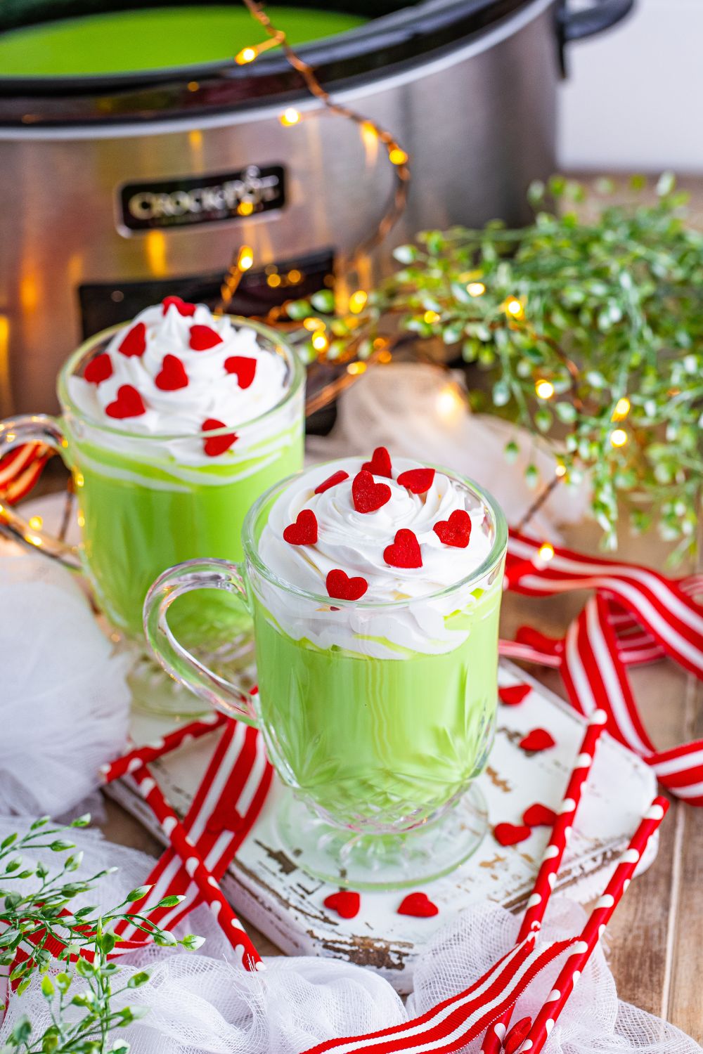 two glasses of green hot chocolate on table