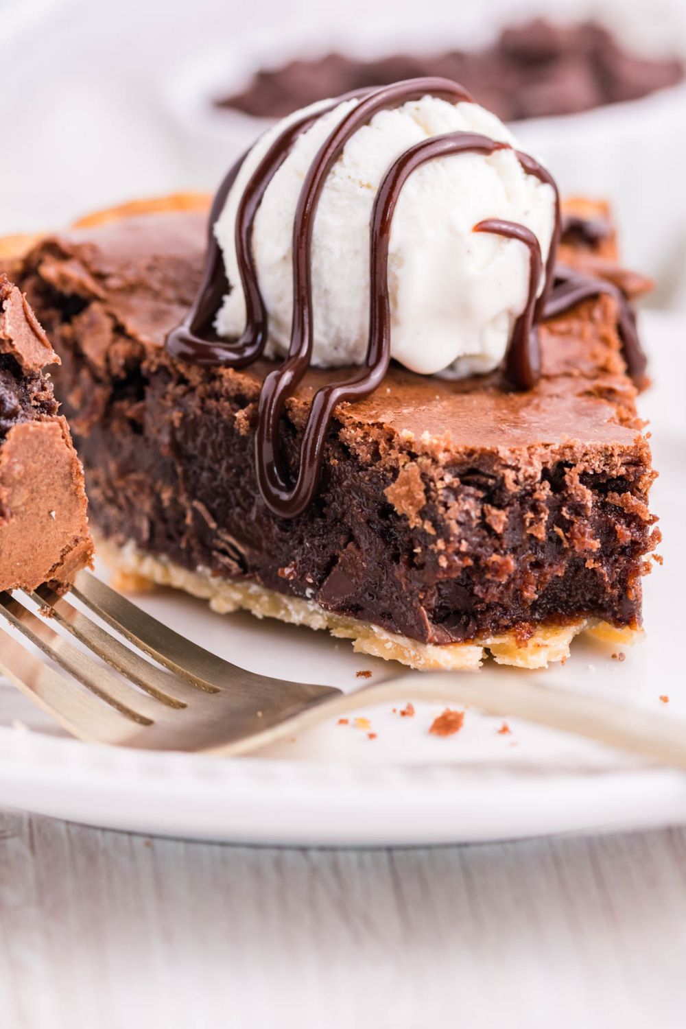 slice of pie with hot fudge and ice cream
