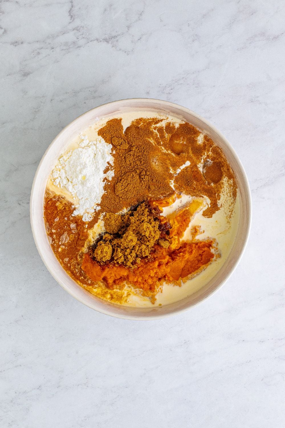ingredients for pumpkin pie in a bowl 