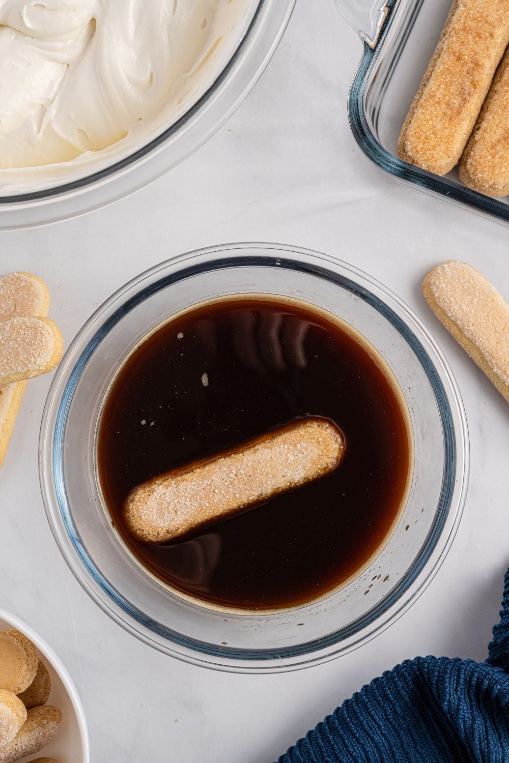 lady finger in a bowl of coffee