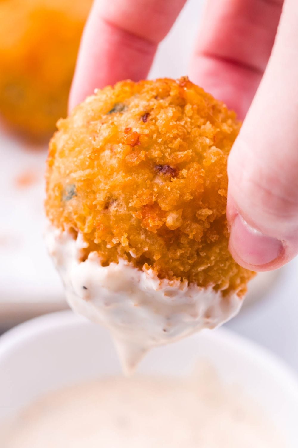 Jalapeno Popper Bite being dipped in ranch dressing