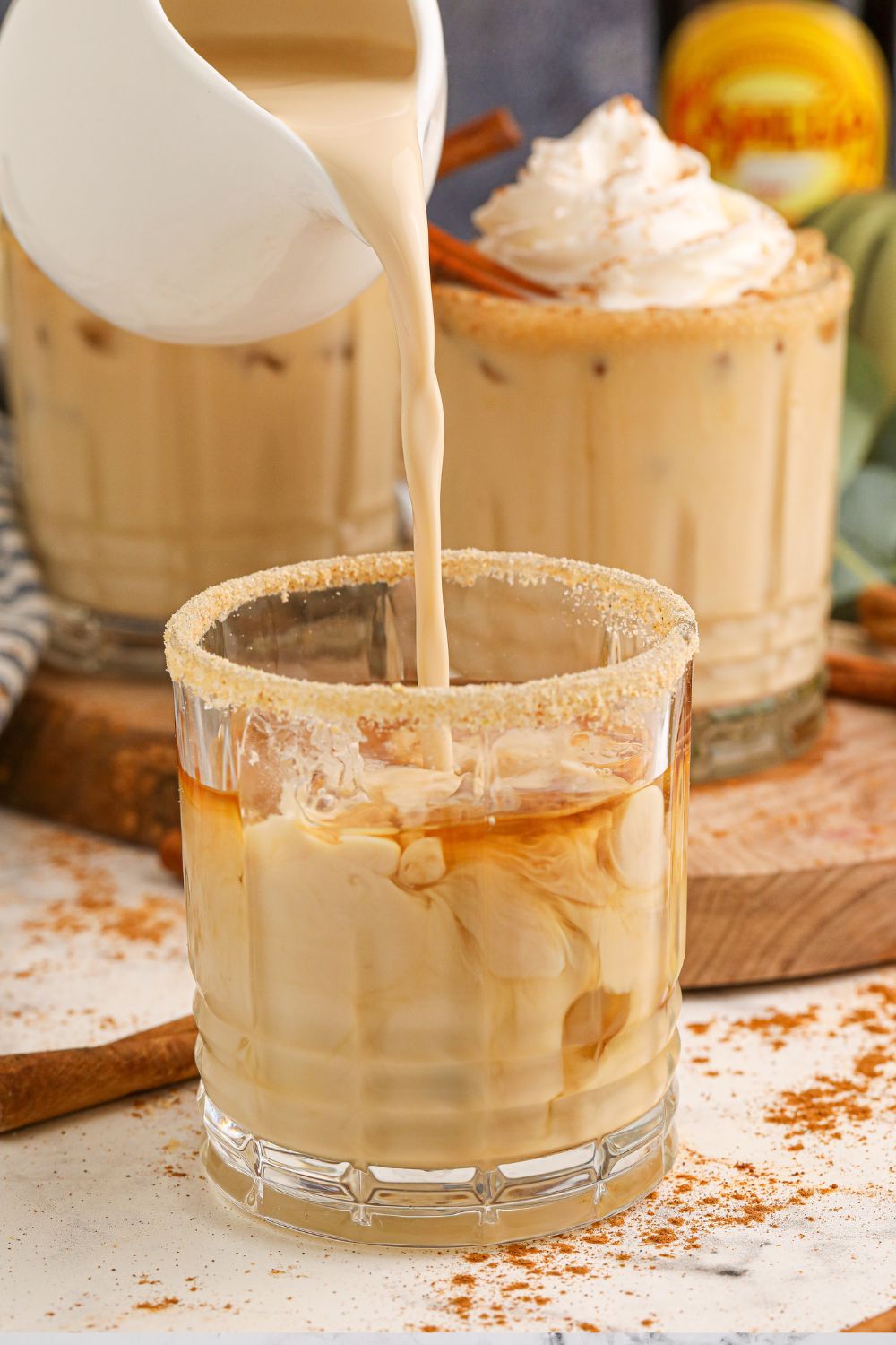 pouring kahlua into white russian drink