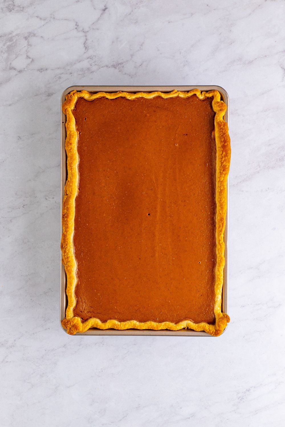 pumpkin pie baked in pan on table 