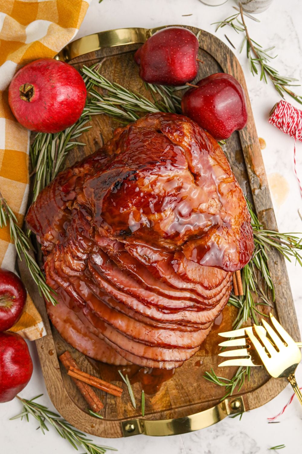 Dr. Pepper Ham on a cutting board with garnish around it