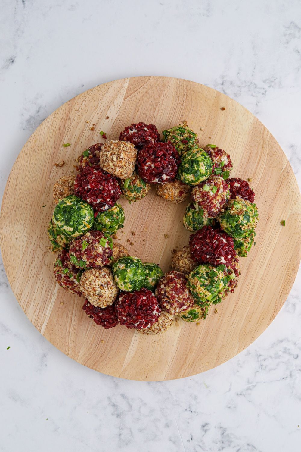 round board with cheeseballs shaped in a round shape