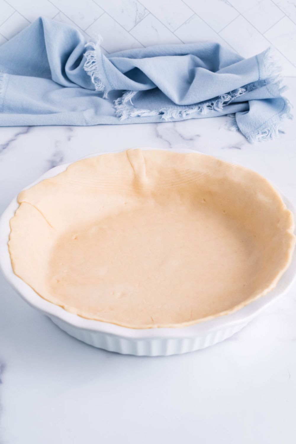 pie crust in pan on table
