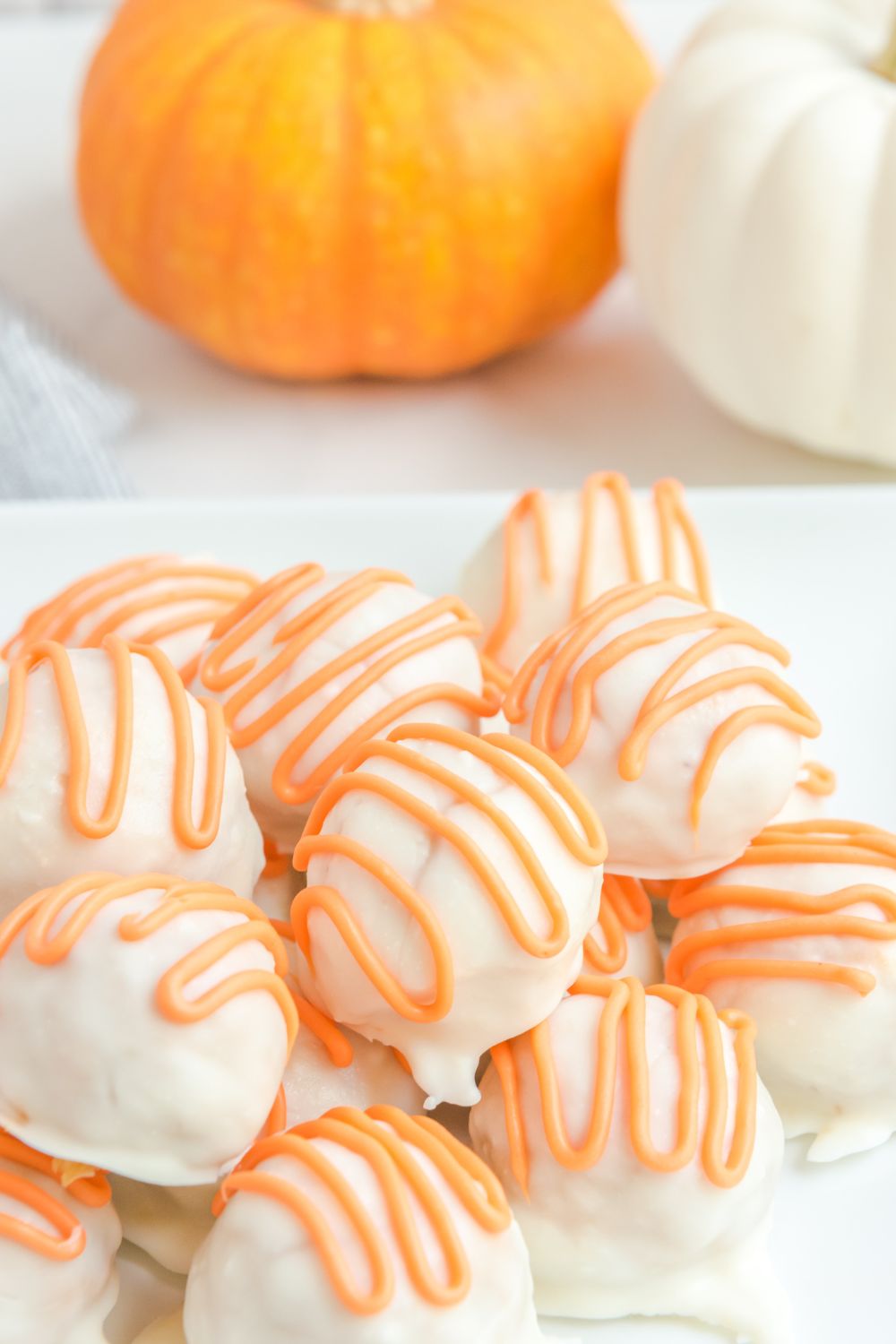 White Chocolate Pumpkin Truffles on a plate 