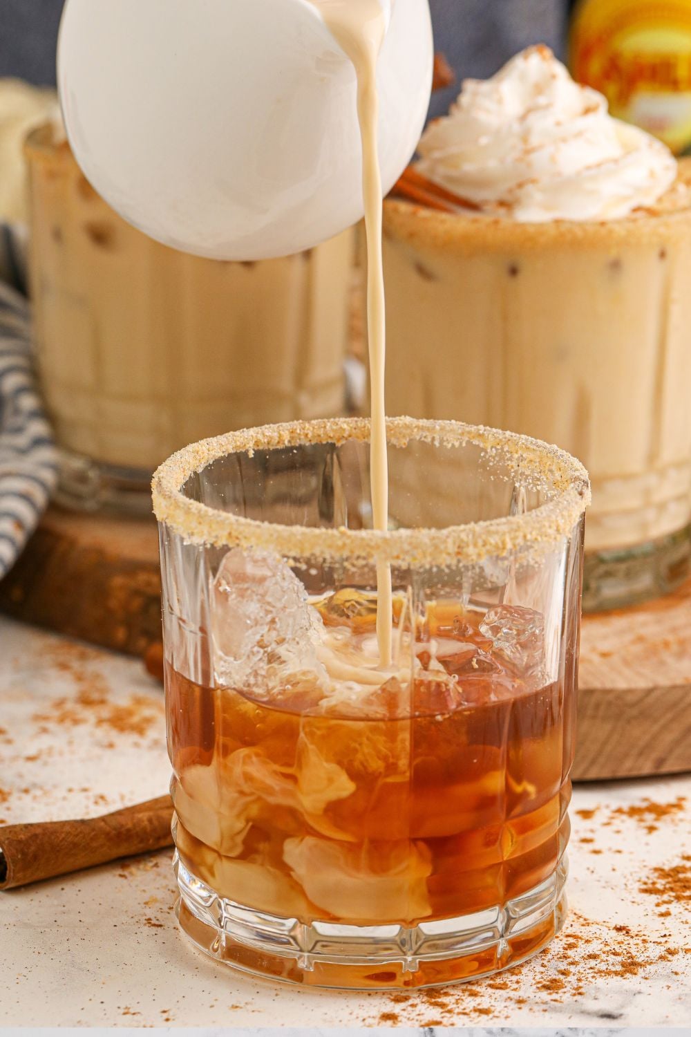 pouring creamer into white russian drink
