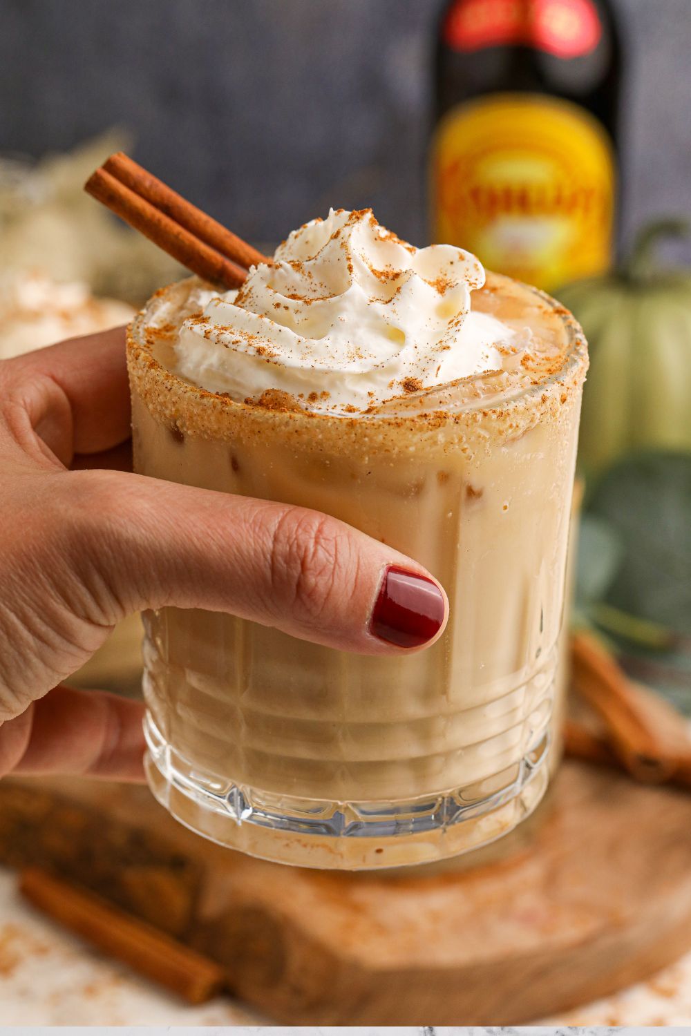 glass of pumpkin white russian in hand