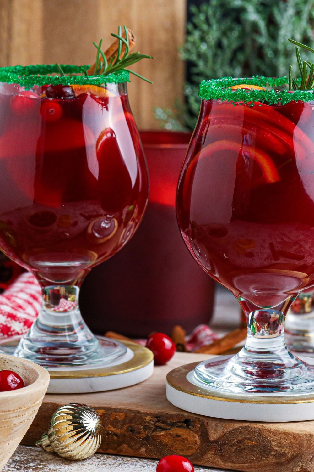 Christmas Sangria in glasses with green sugar rims
