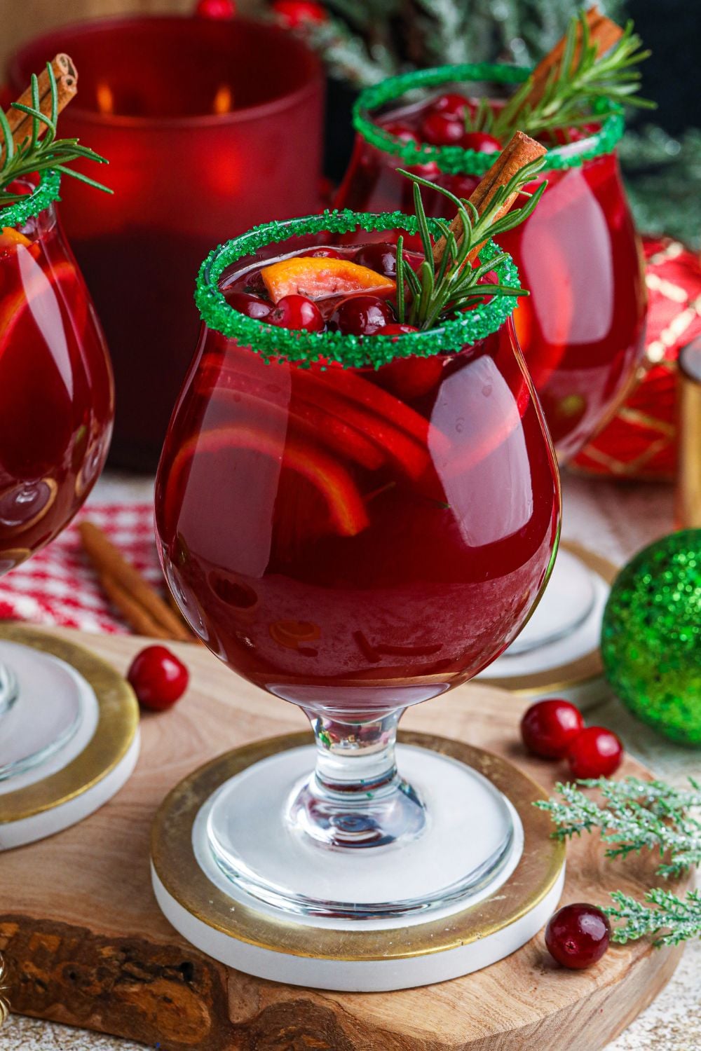 Christmas Sangria on table with berries around it on table