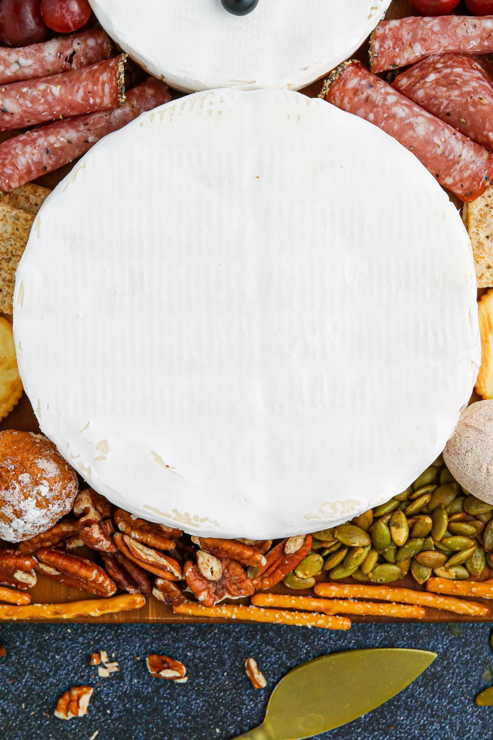 close up view of brie wheel on serving tray