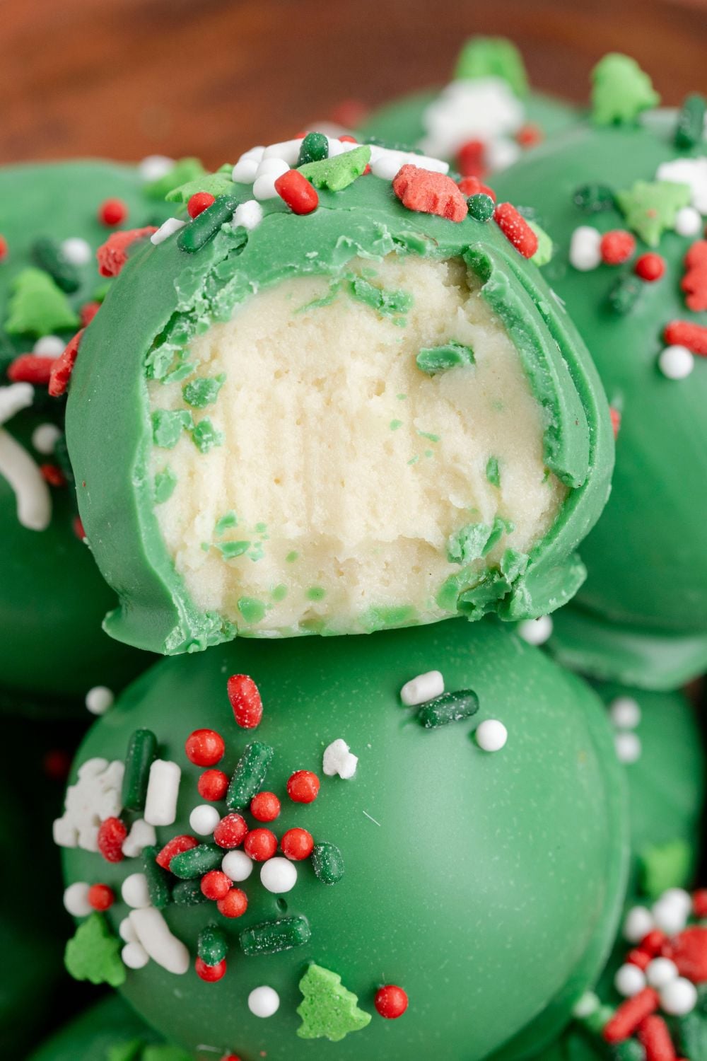 sugar cookie truffles in bowl with a bite taken out of it