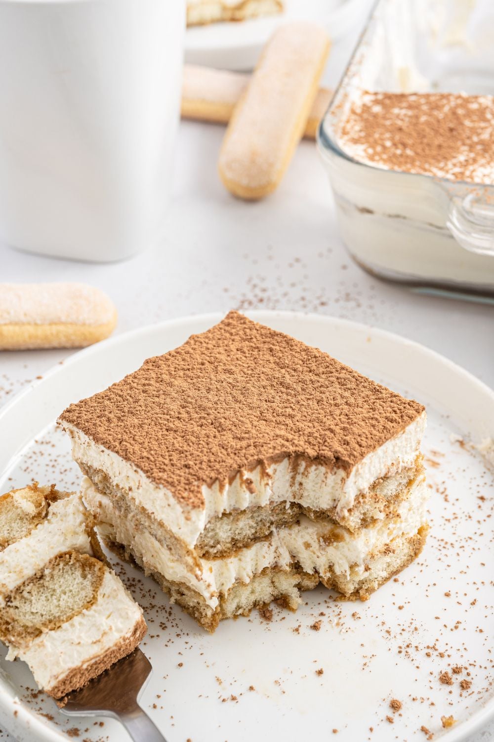 fork with a bite of tiramisu on plate