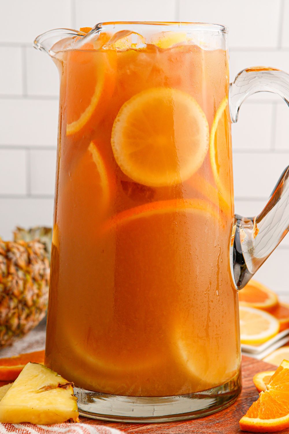 Touchdown Tea in a pitcher with fruit slices in the container